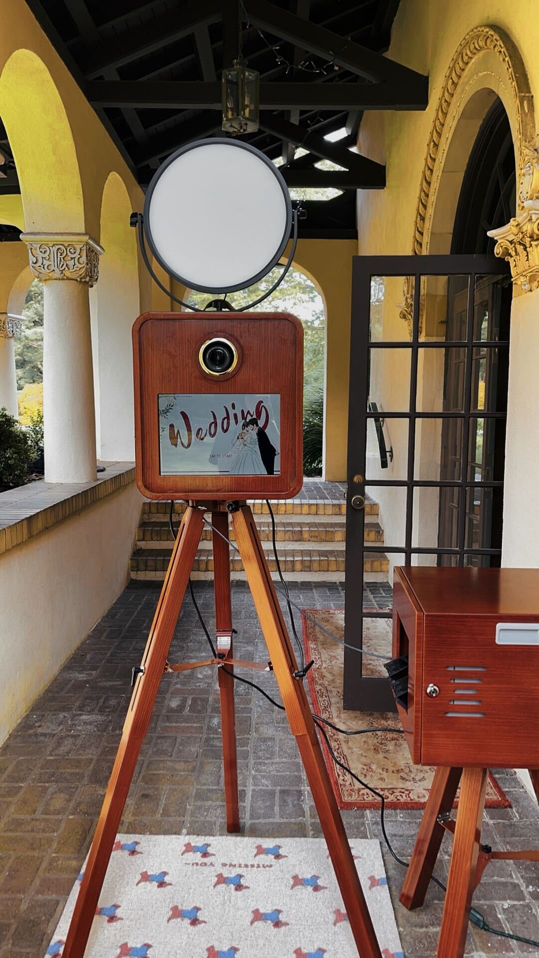 Snapbooth’s vintage wooden photo booth with ring light and tripod